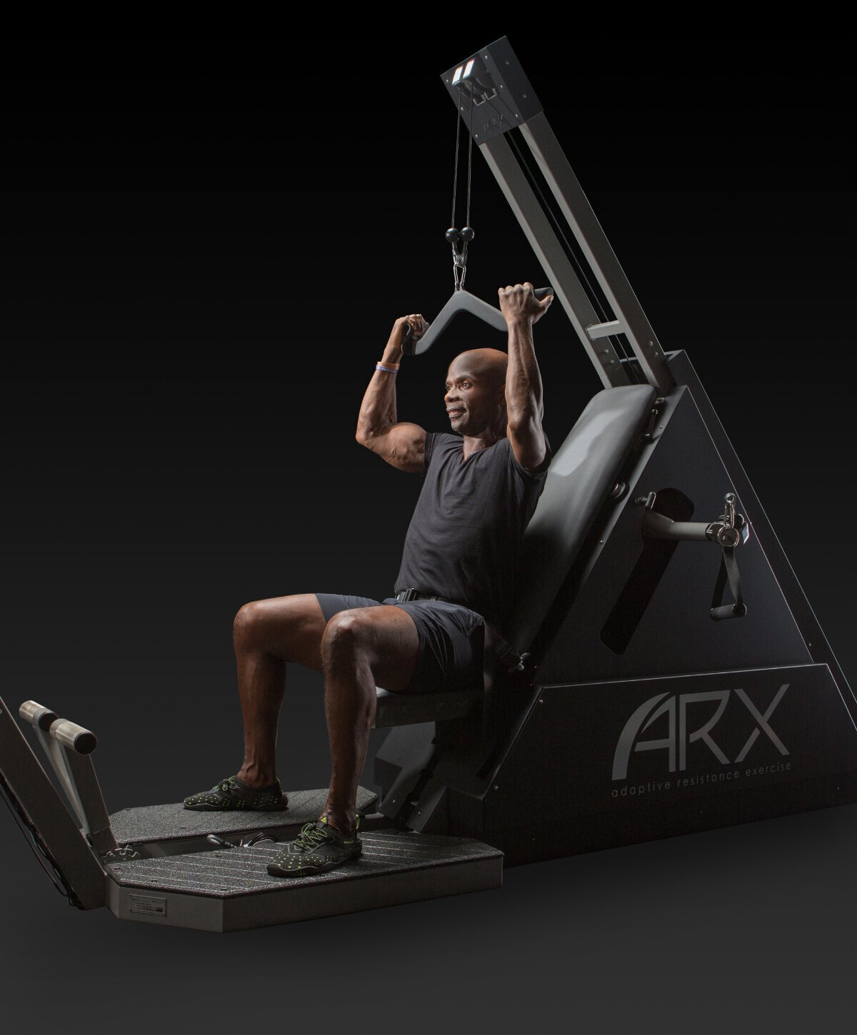 houston concierge fitness model sitting on workout machine